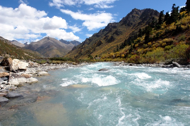 A raging glacial stream near Ranwu Lake in Eastern Tibet provides a symbol of a journey to be taken.